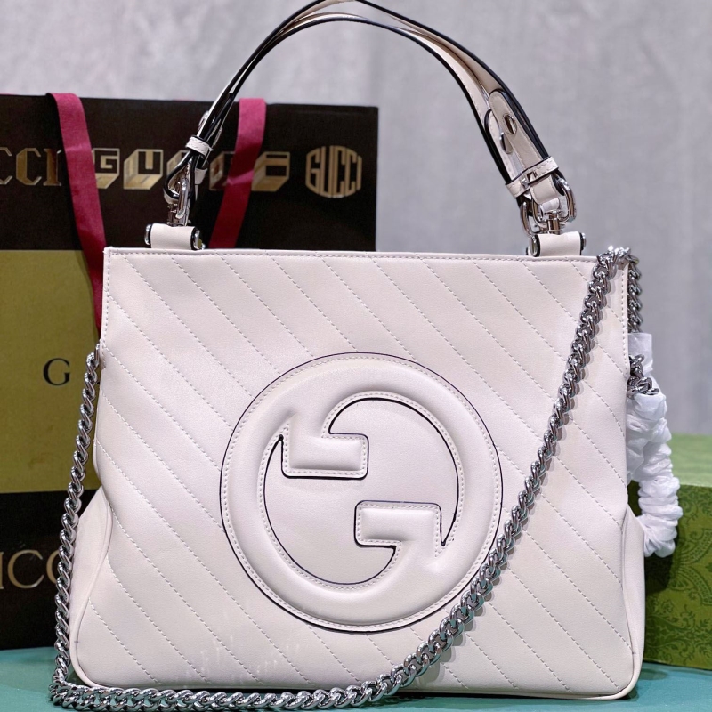 G*u*i shopping bags